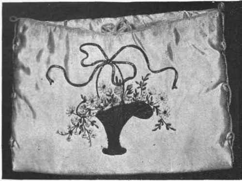 Basket worked in brown embroidery and gold thread, miniature ribbon flowers in natural colours