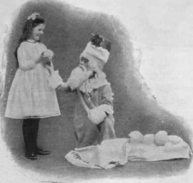 Father Christmas giving away his snowballs, each of which has a wee present hidden inside