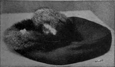 Foot muff of fur lined felt, which can easily be made at home.