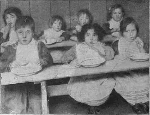 In The Creche The West London Mission provides for children whose mothers have to go out to work. Fourpence a day is charged for each child