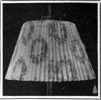 Pleated chintz shades such as this can be made at a cost of less than 2s. each, and are both pretty and serviceable