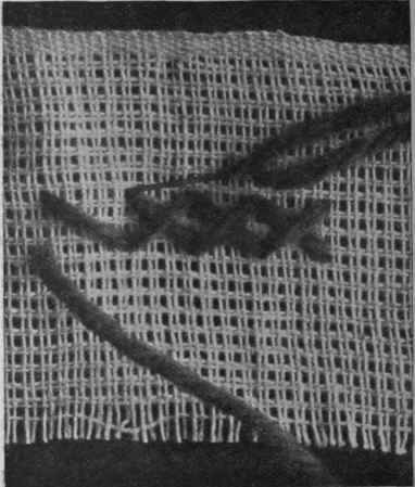 Another form of cross stitch for darning a rent or thin place in woollen materials