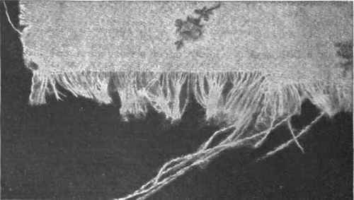 If woollen stuff is patched with its own material the patch should be darned in position with threads unravelled, as above, from a spare piece of the stuff