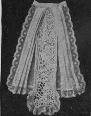 The strip of real Irish crochet lace gives a dainty effect to the jabot