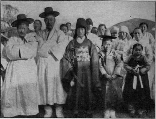 A Korean wedding group. Marriage is regarded with the deepest veneration in Korea and a bachelor is looked upon with contemptuous pity