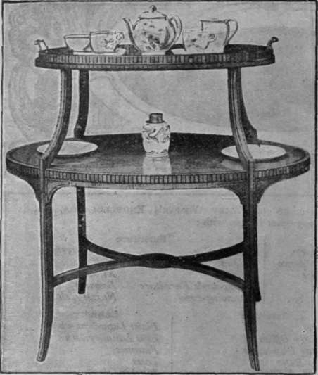 A charming two tier Sheraton tea table. The top tier is fitted with a loose tray of plate glass, on which the tea things are placed. The lower tier serves as a receptacle for cake and plates