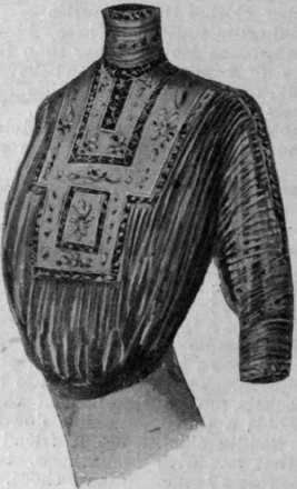 A dainty blouse fashioned from a partly worn muslin skirt. Arrange any embroidery there may