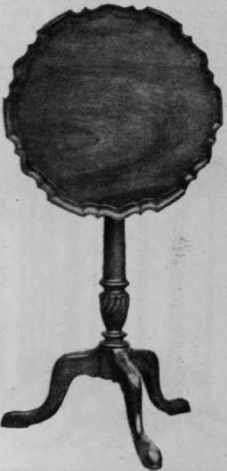 A folding tripod table with a moulded edge, a good example of the later Chippendale period.