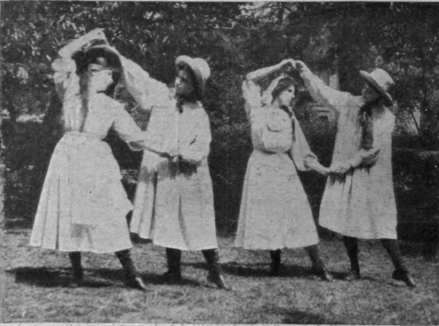 A pretty figure of the St. Leger (Sellenger's) round. The costumes are those of old world village girls and boys