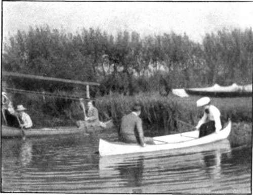 An elopement race in canoes always proves amusing after tea. Don forget to sign the register