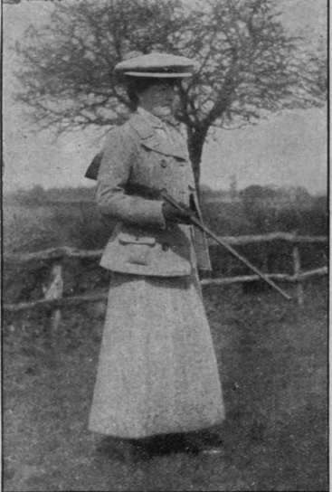 (Fig. 1). The wrong way to carry a gun, andsince the introduction of the light, hammerless modern gun, shooting has become an excellent sport for women, well within the average feminine capacities