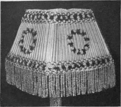 Fig. 3. A pretty candle shade, trimmed with narrow braid and
