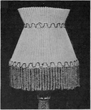 Fig 4. A nightlight shade of corrugated linen or of silk over a wire foundation. A narrow braid and a bead fringe will complete the design Selfridge