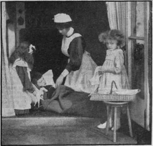 The  hospital  where the children tend the sick and apply surgical aid to the wounded. This part of the work falls to the share of the little girls, who thus learn invalid cookery and first aid, as well as elementary nursing