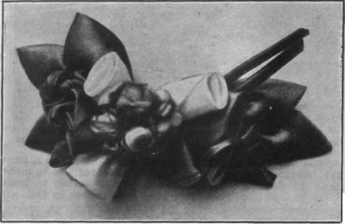 A pretty posy of ribbon flowers to be worn with a hat or blouse of the same colour