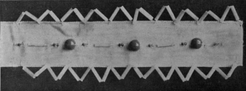 A ribbon with a vandyked edging of bugles and a centre line of bugles and beads, makes a pretty trimming for a corsage or a hat