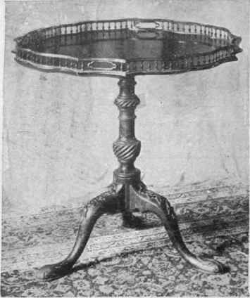 Chippendale occasional table with gallery and carved legs. The gallery is a useful factor in preventing objects from slipping off the polished surface of the table is most useful for preventing small objects from rolling off the polished surface of the occasional table when it is being moved