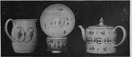 Earthenware milk jug, cup, saucer, and teapot of Leeds pottery, daintily painted with flowers and wreaths from the South Kensington Museum