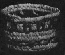 Small basket in raffia work with decoration of coloured strands