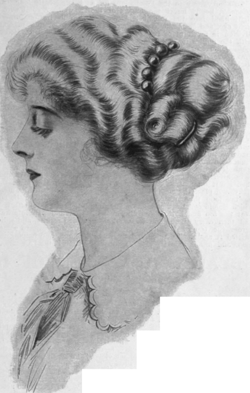 The coiffure viewed in profile, showing the soft, waved effect and the graceful arrangement of the back dressing. The comb with large knobs adds a useful finishing touch