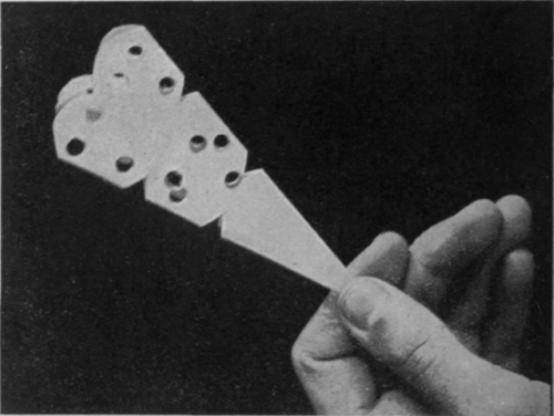 The paper as it appears when punched, ready for unfolding