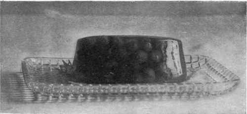 Jelly With A Bunch Of Grapes Molded In It.