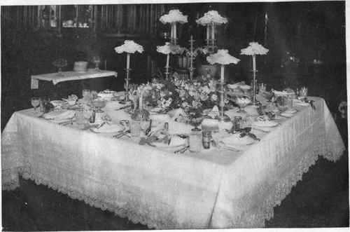 Square Cornered Dinner Table With Fourteen Covers.