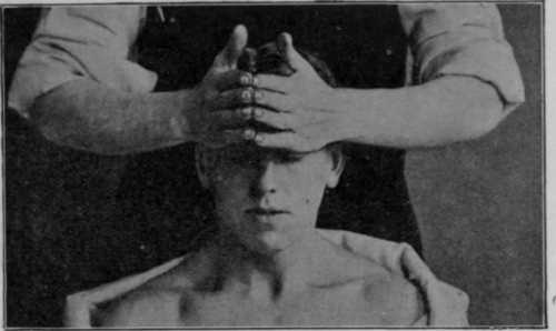 Fig. 134.   Forehead stroking: patient sitting. Commencement of the movement