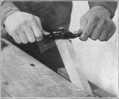 Fig. 57. Using the spokeshave.