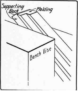 Fig. 81. Holding member of picture frame in vise to trim the miter.