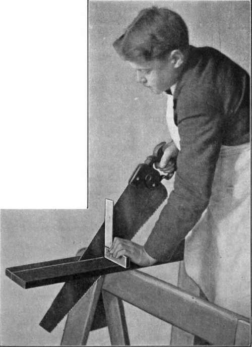Fig. 19.   Use of the Saw. Showing the method of using a try square to insure accuracy.
