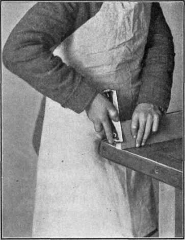 Fig. 34.   Using Block Plane upon Small Pieces.