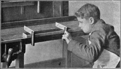 Fig. 6.   Use of Two Try squares to See if Piece of Wood is Out of Wind.