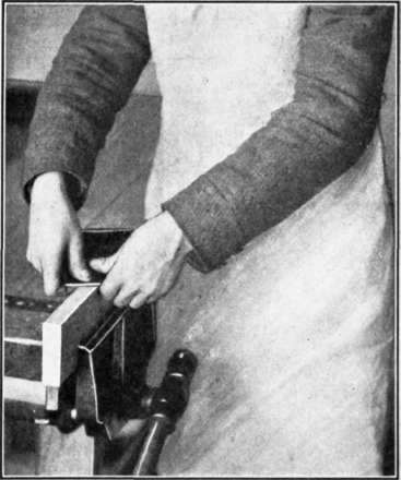 Fig. 60.   Method of Grasping the Scraper when working upon an edge.