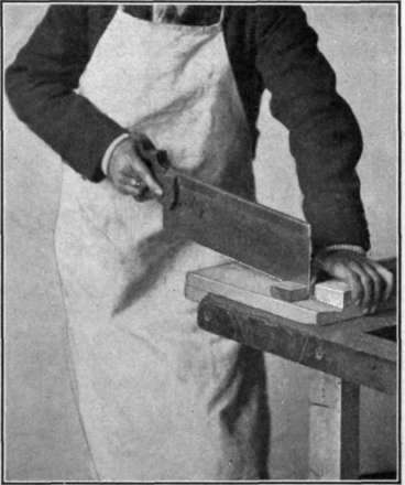Fig. 88.   Use of the Bench Hook and the Backsaw.