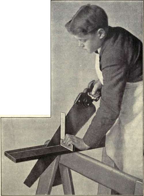 Fig. 43.   Use of the Saw. Showing the method of using a try square to insure accuracy.