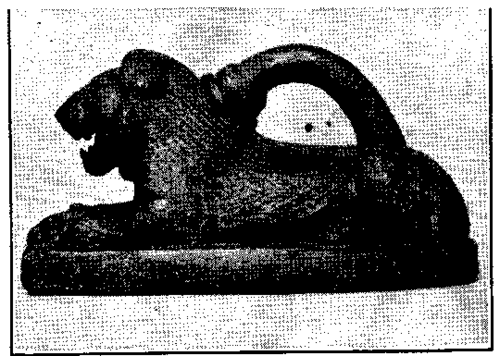 Bronze lion weight.