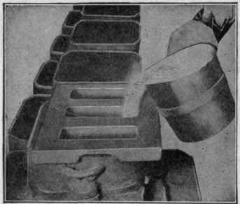 Fig. 1. Pouring Molten Metal into Molds for Casting Iron Sole Plates