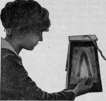 Operator Holding Element Before Strong Light to Detect Defects in the Mica