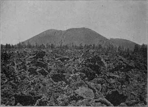Sunset Butte, Arizona. An extinct volcano, with scoriaceous block lava in foreground.
