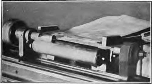 Case rolling machine showing pasting notch.