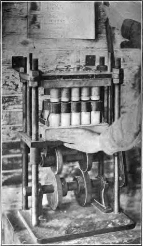 Light cases assembled on loading machine.