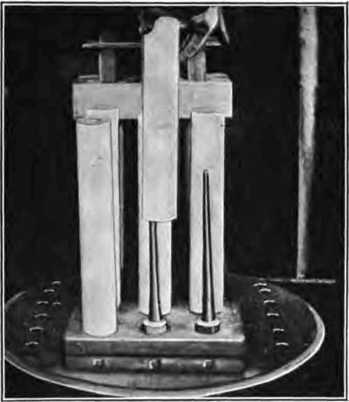 Placing cases on spindles.